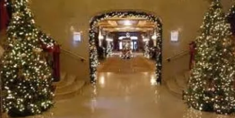 hotel lobby decorated with Christmas lights