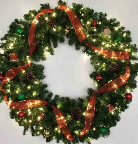 Traditional Christmas wreath with red ribbons
